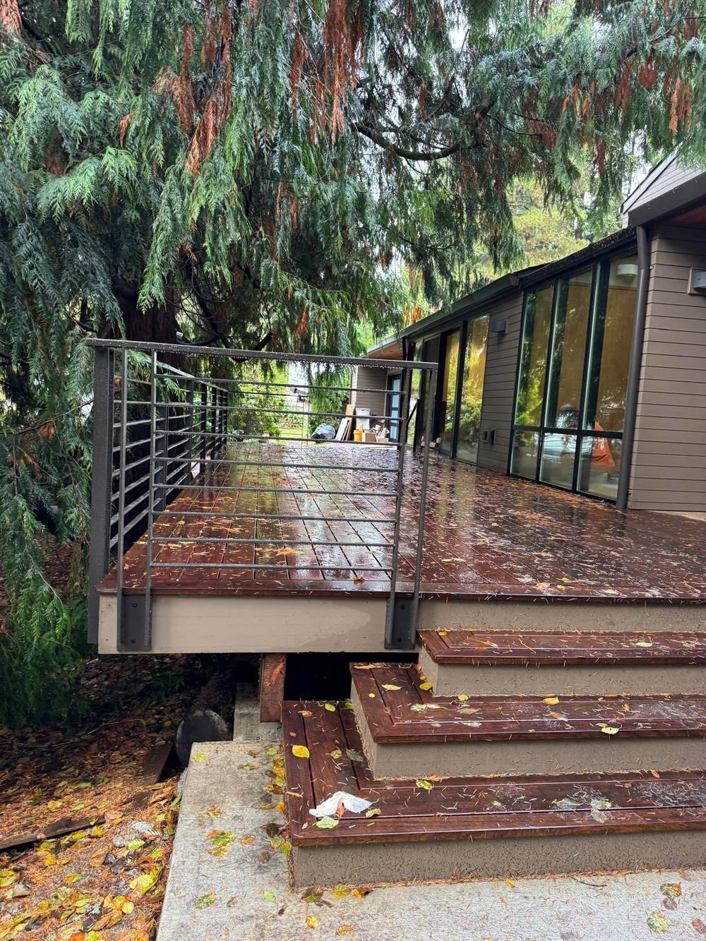 Deck and siding on a wooded Eastside home