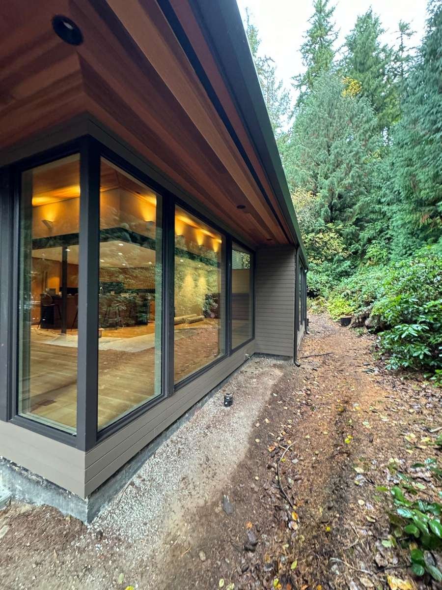 Lap siding, wood door and dark-framed windows